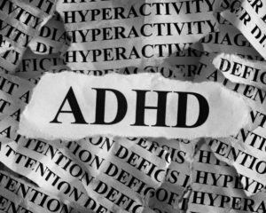 ADHD with the words hyperactivity and attention deficit in the background