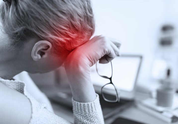 grey image of a woman with glasses in hand and red area over her heard used on a blog about mast cell activation syndrome