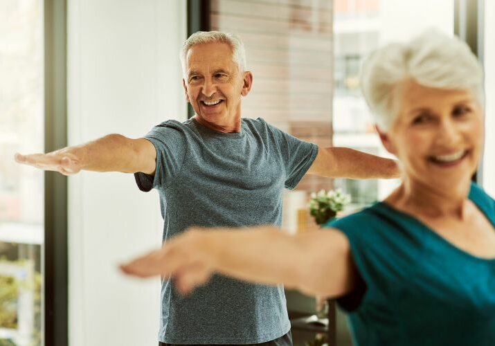 older couple exercising to help influence cancer risk