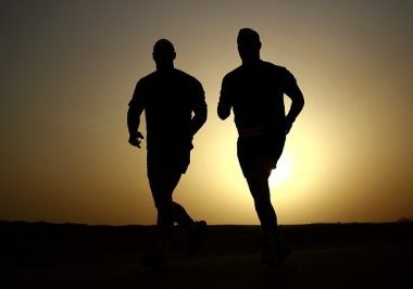 silhouette of 2 men running | mens health supplements that work | Perpetual Wellbeing